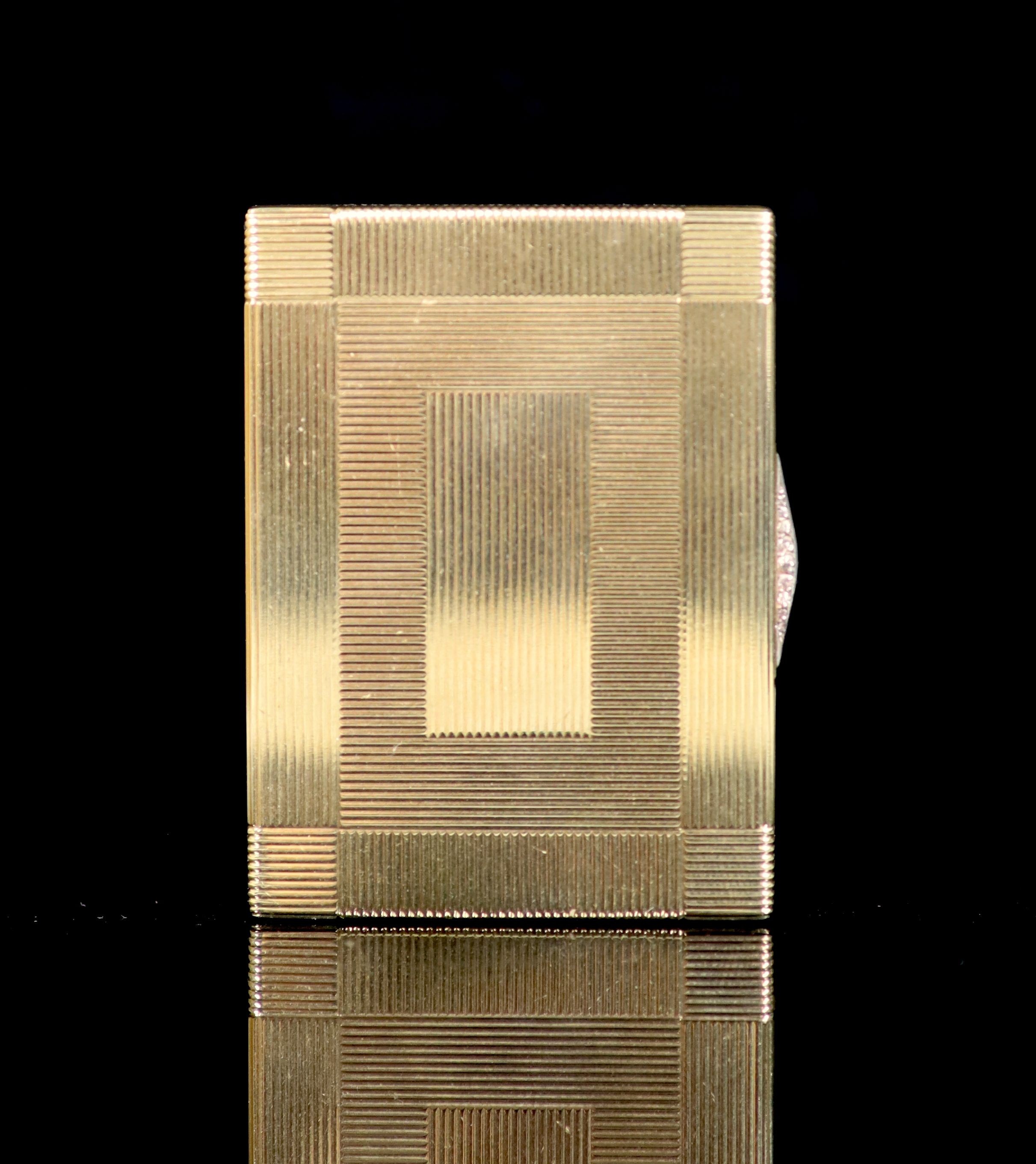 A 1930's Cartier 9ct gold compact, with diamond set thumbpiece